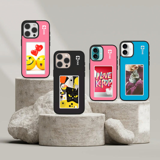 Four TIZAG Digital Canvas Cases displayed on gray stone platforms: a pink case with smiley faces and hearts, a black case with an abstract black cat design, a pink case with 'I Love K-Pop' text, and a blue case with a cat photo.